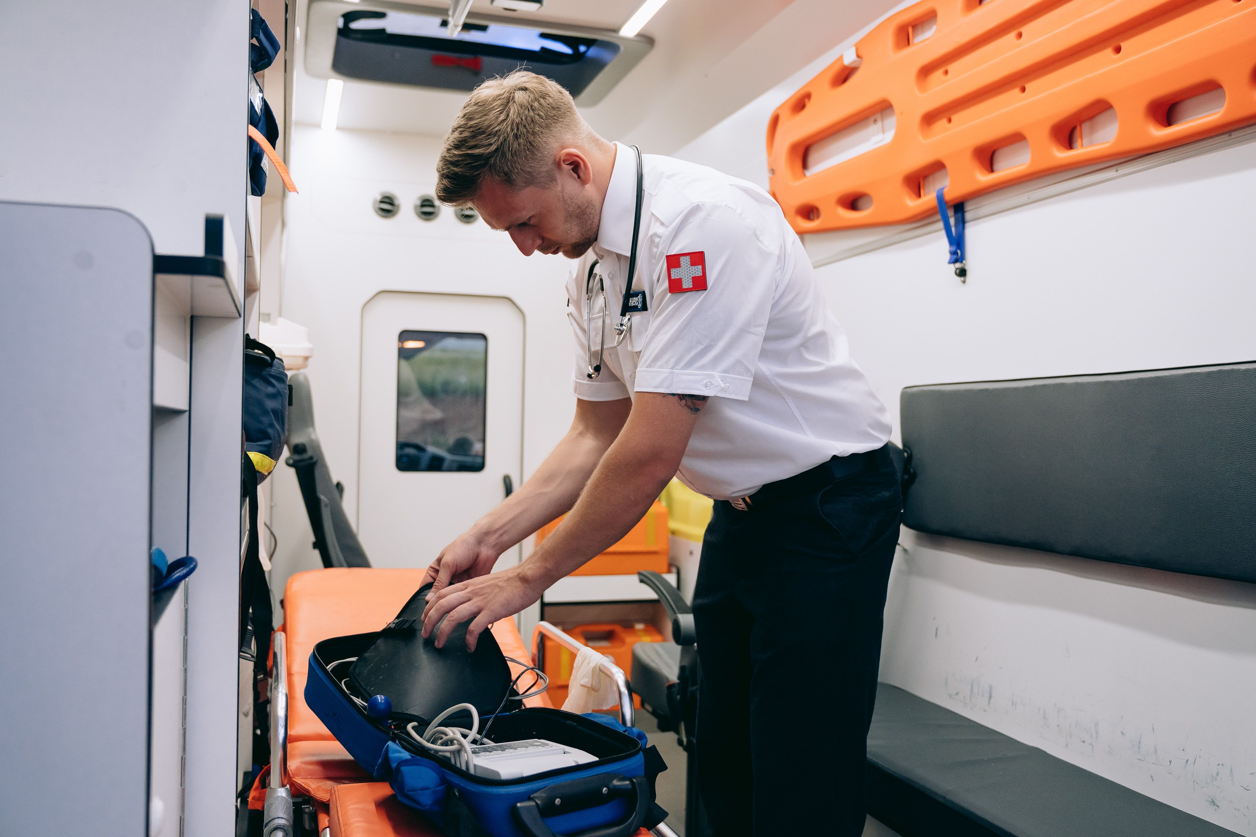 Emergency healthcare professional preparing medical equipment